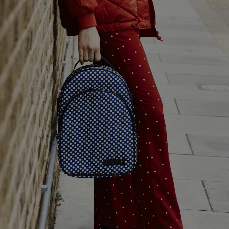 girl holding blue clarinet case