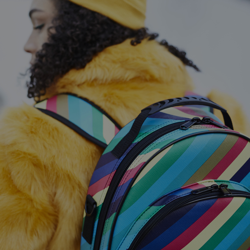 musician wearing yellow jacket with candy band clarinet case