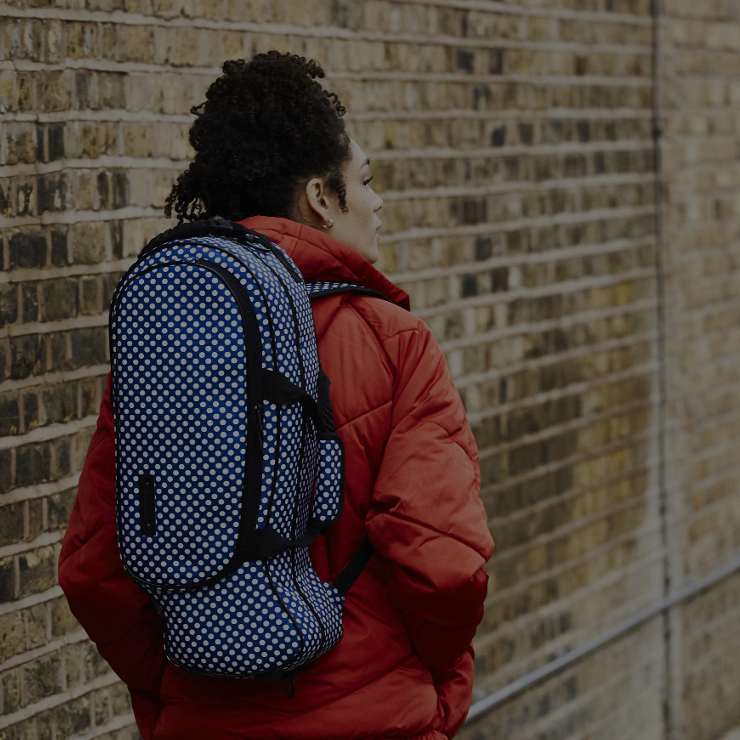 girl walking with trumpet case