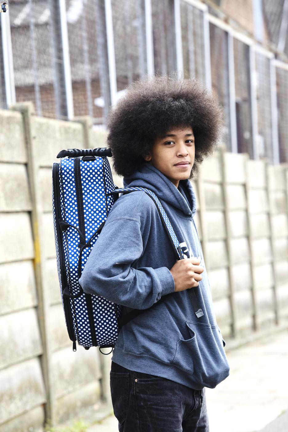 Boy Carrying Blue Sax Case