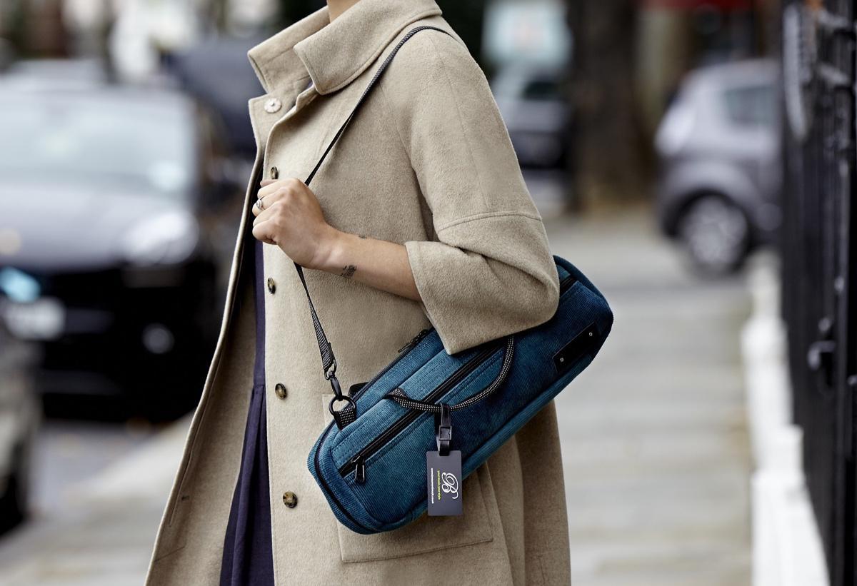 Girl Carrying Teal Cord Bag