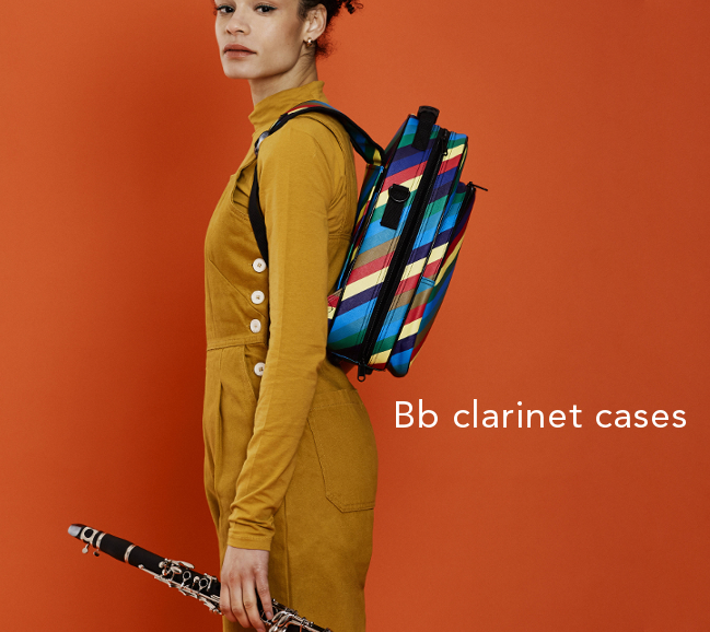 girl standing with candy band clarinet case